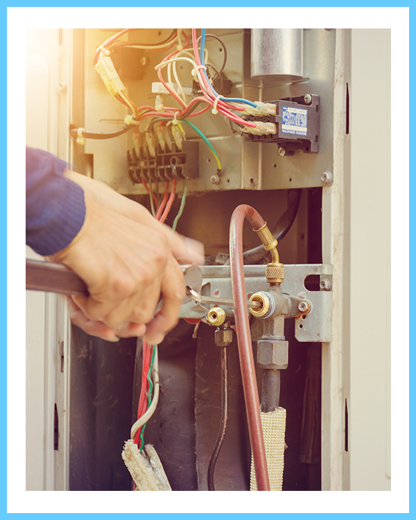 Repairman fixing an air conditioning system.