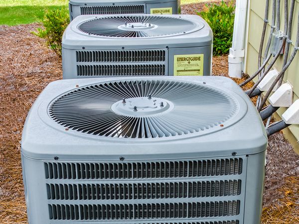 3 air conditioning units outside