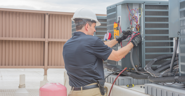 Man working on AC unit