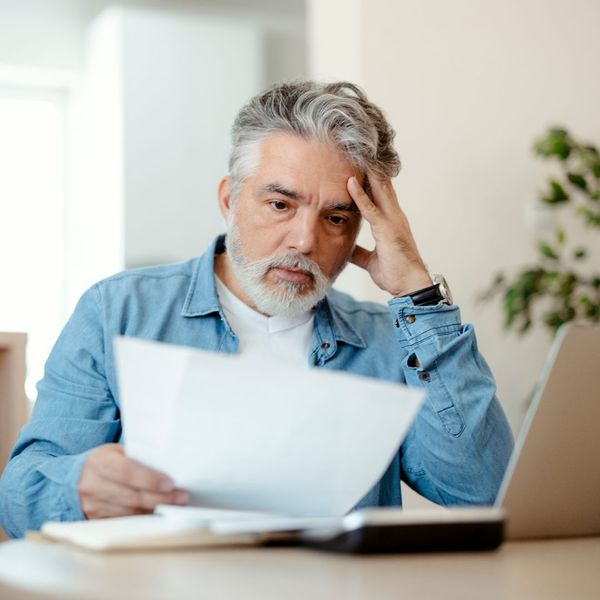 man looking at utility bill