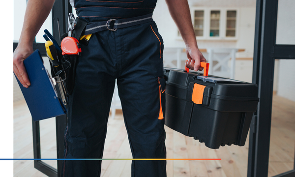 Repairman with toolbox and clipboard