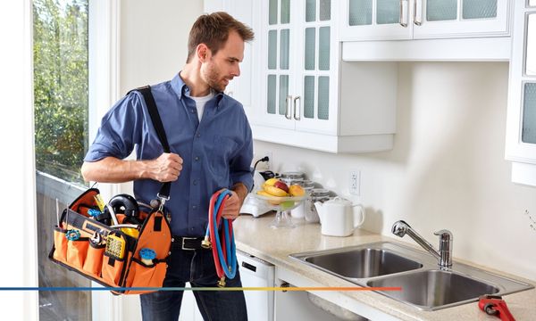 Plumber looking at a sink