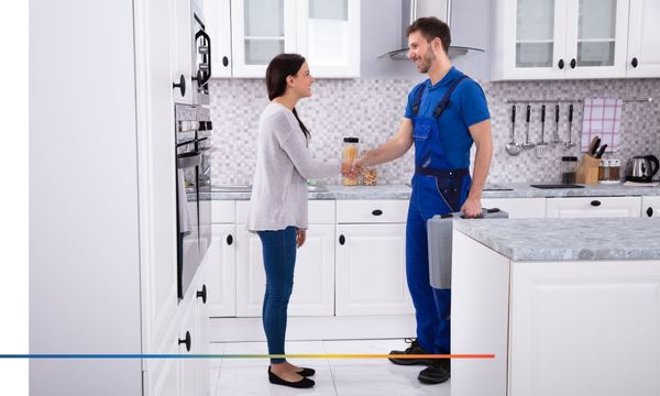 Customer handshake with plumber