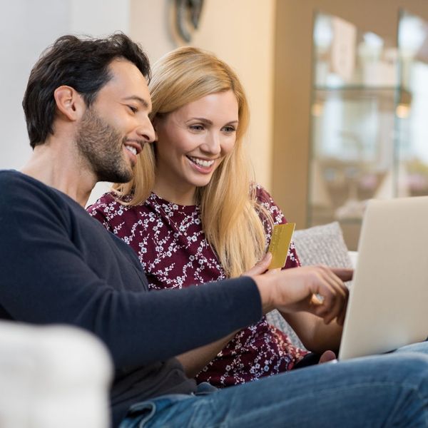 happy couple looking at water bill