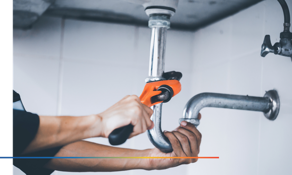 plumber at work in a bathroom, plumbing repair service, assemble