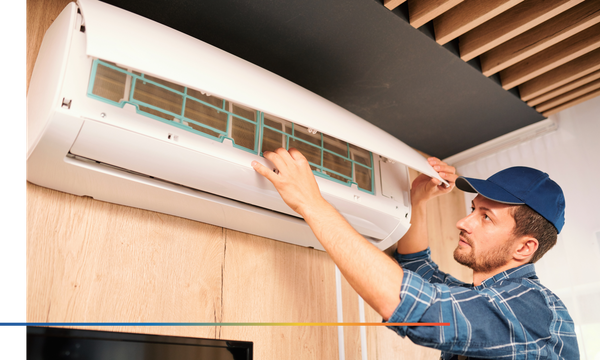 someone repairing a wall A/C unit