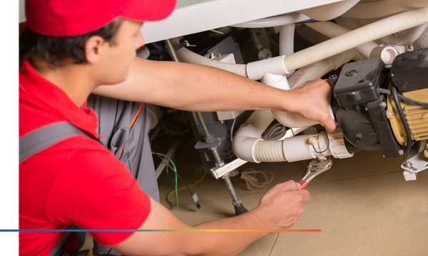 plumber fixing a water pump