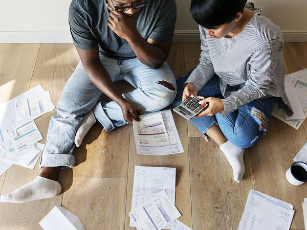 Couple managing their housing debt by preventing foreclosure.