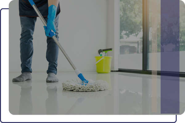 A worker mopping a coated floor