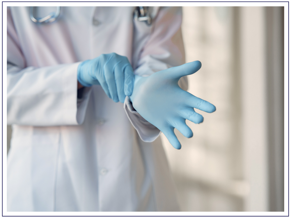 healthcare professional putting on gloves