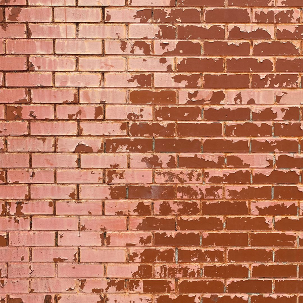 faded paint on brick