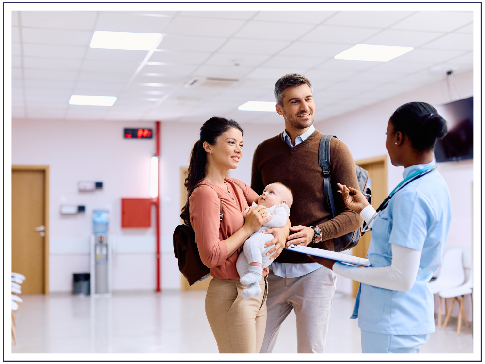 couple talking to doctor in waiting room