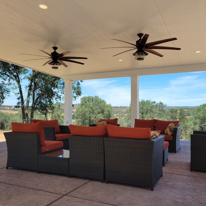 covered outdoor patio with ceiling fans