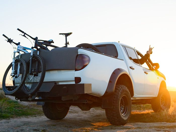 Pickup with aftermarket bumper with bikes in the back