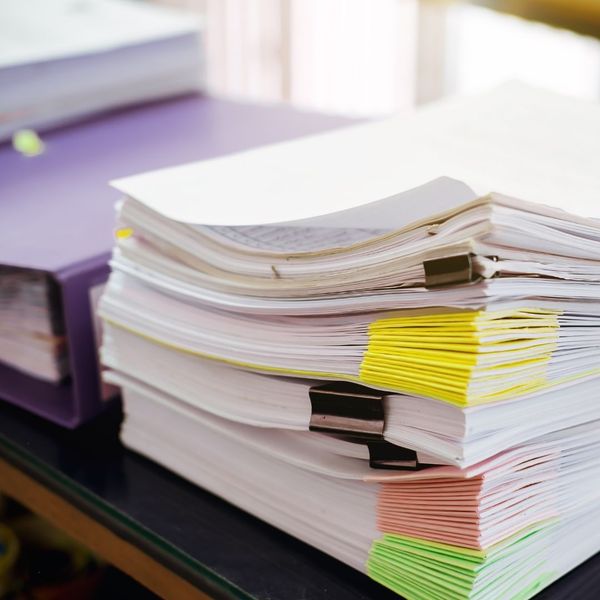 stacks of organized, colored, collated paperwork