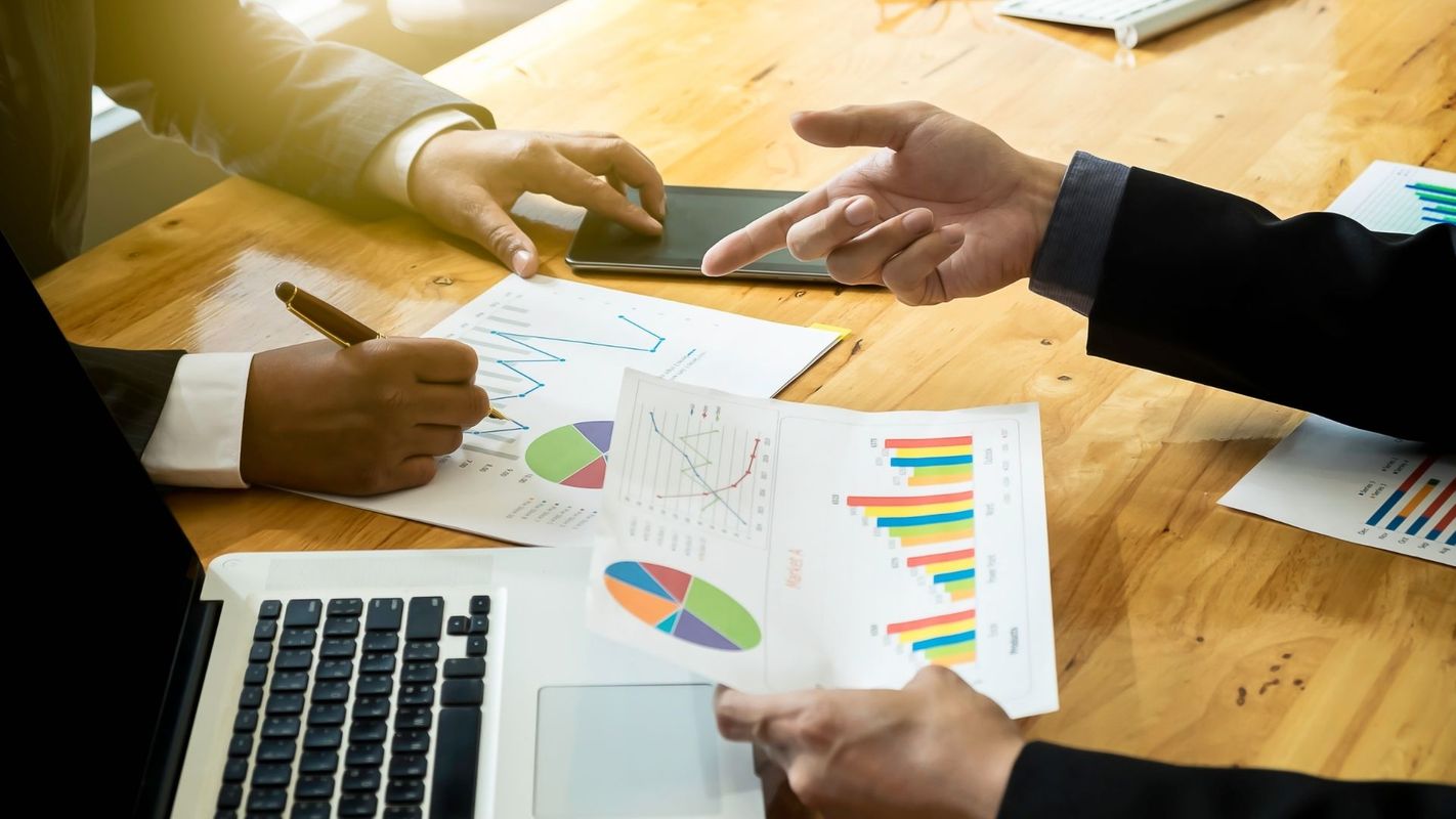 pointing at charts and graphs