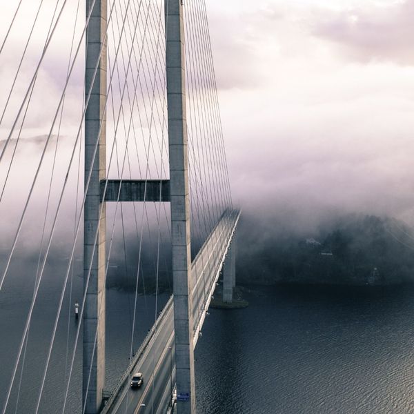 A modern bridge connecting two shores, symbolizing the link between capital and opportunity.