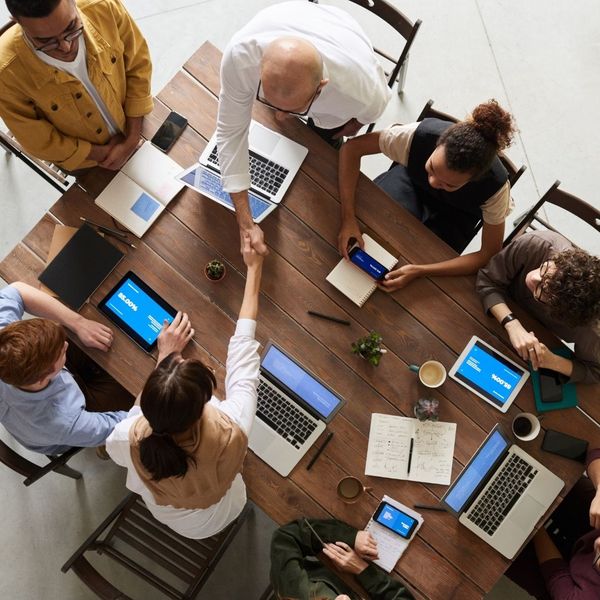 handshake across business meeting table