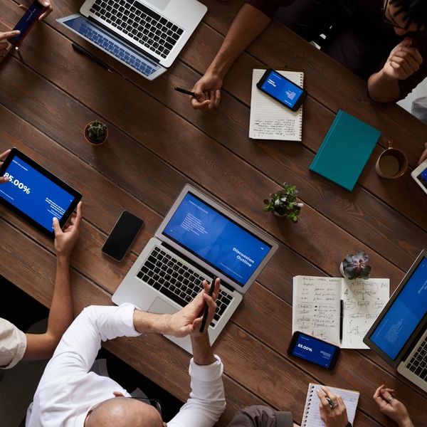 A diverse group of business owners collaborating in a modern office. A diverse group of business owners collaborating in a modern office.