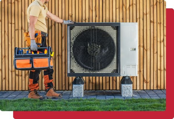 HVAC techinician standing next to a large unit
