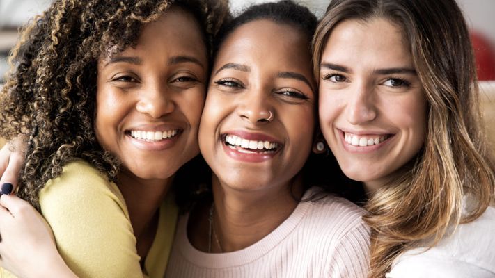 three-beautiful-smiling-girl-friends-hugging-toget-2022-12-17-03-39-04-utc-1024x576.jpg