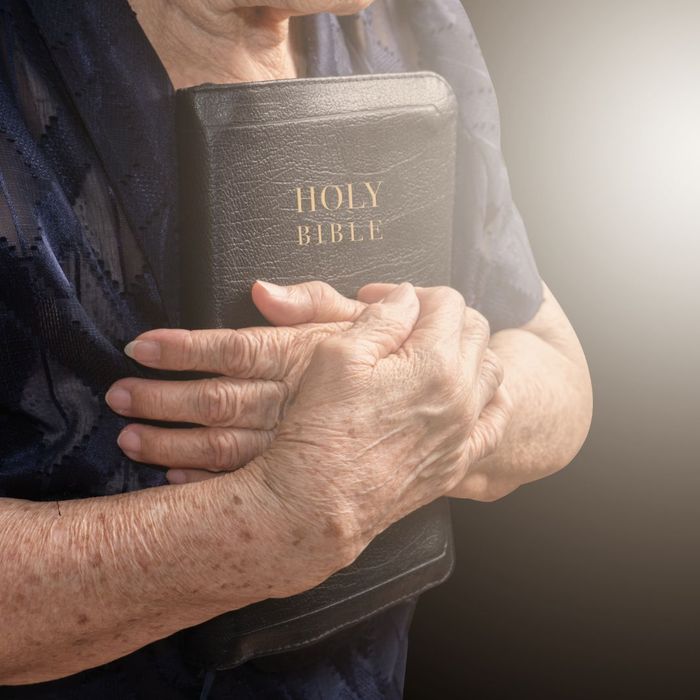 holding bible 