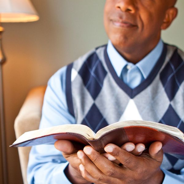 Man holding a Bible