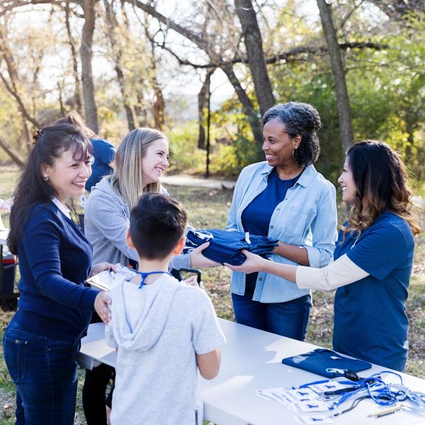 Volunteers gathered around a check-in table