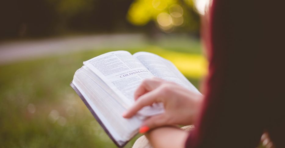 Woman reading a Bible. 