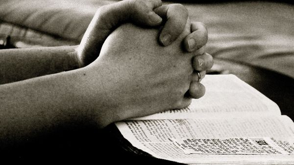 black and white hands praying