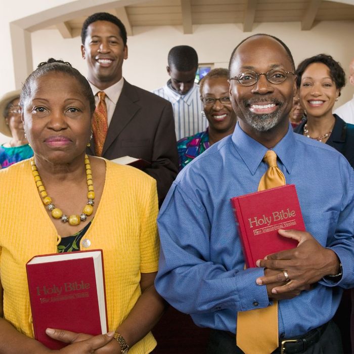People holding Bibles in a church