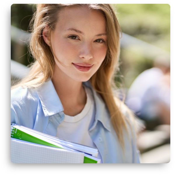 Female student holding notebooks