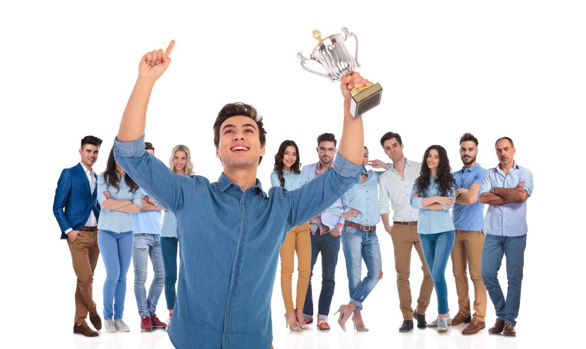 high school students one holding trophy.jpg