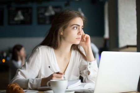 Student on computer thinking.jpg