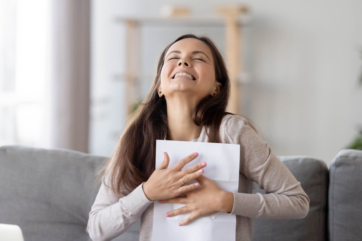 Happy student with acceptance letter.jpg