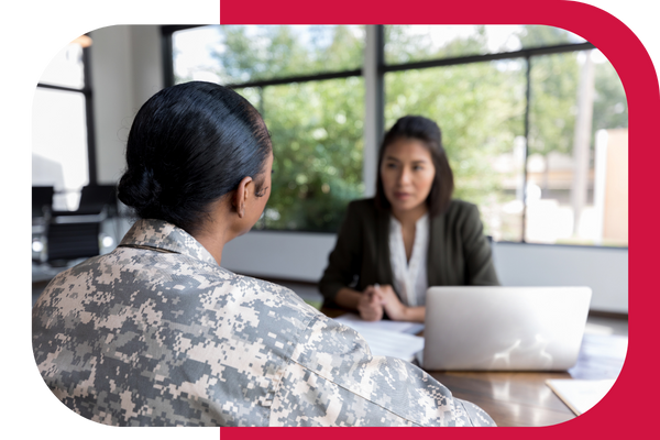 military personnel talking with woman