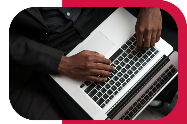 man typing on computer