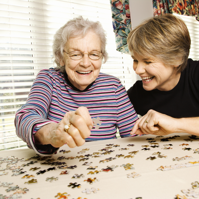 elderly putting together a puzzle