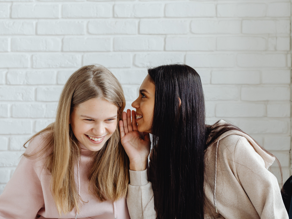 Two women whispering and tallking. Two women whispering and tallking.