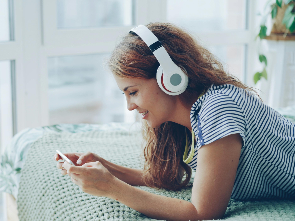A young woman listening to music.
