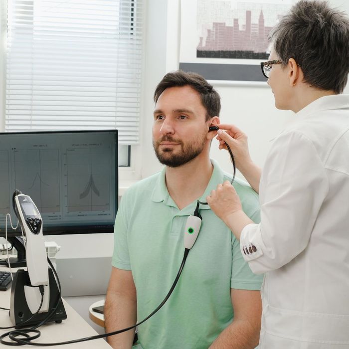 young man getting hearing tested