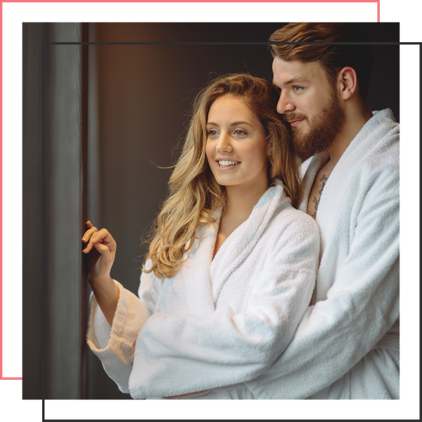 relaxed couple in spa robes