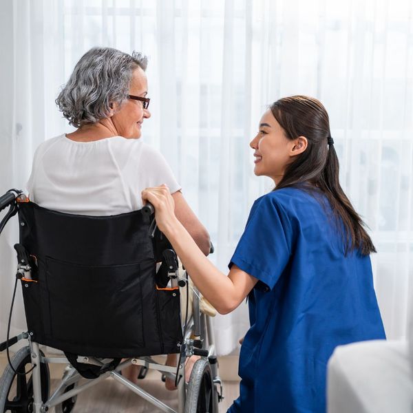 caregiver talking to a senior with dementia