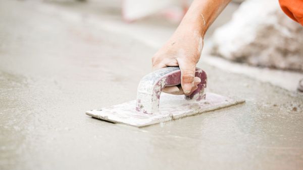 hand smoothing wet concrete