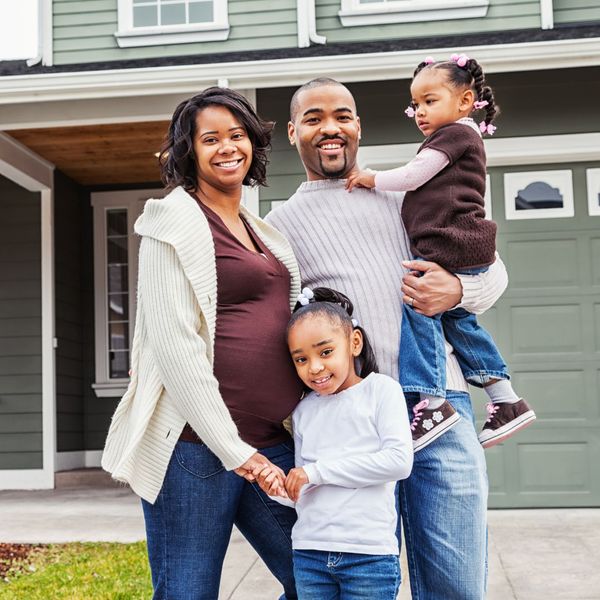 happy family standing near home