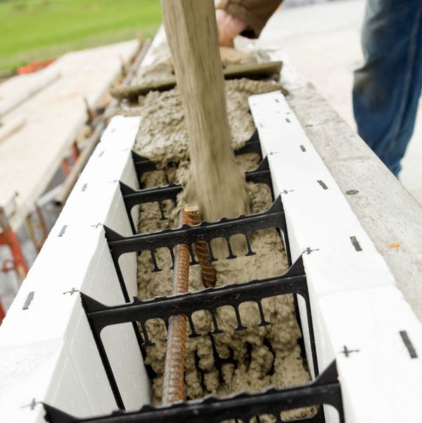 A Insulated Concrete form with concrete  being poured into ti