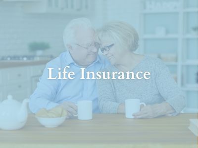 Elderly couple at table drinking coffee