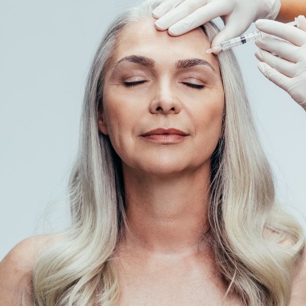 Woman getting facial injections