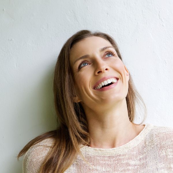 Woman smiling and looking up