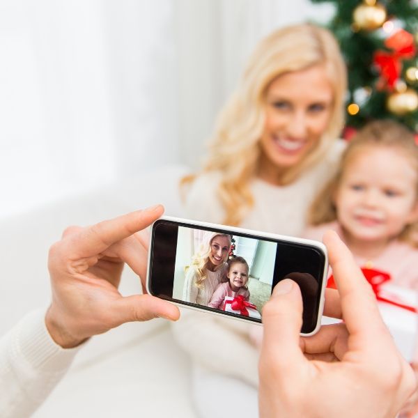 Mother and daughter taking holiday photos